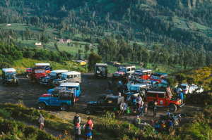 Aerial View of Off-Road Vehicles Gathering in a Mountainous Landscape