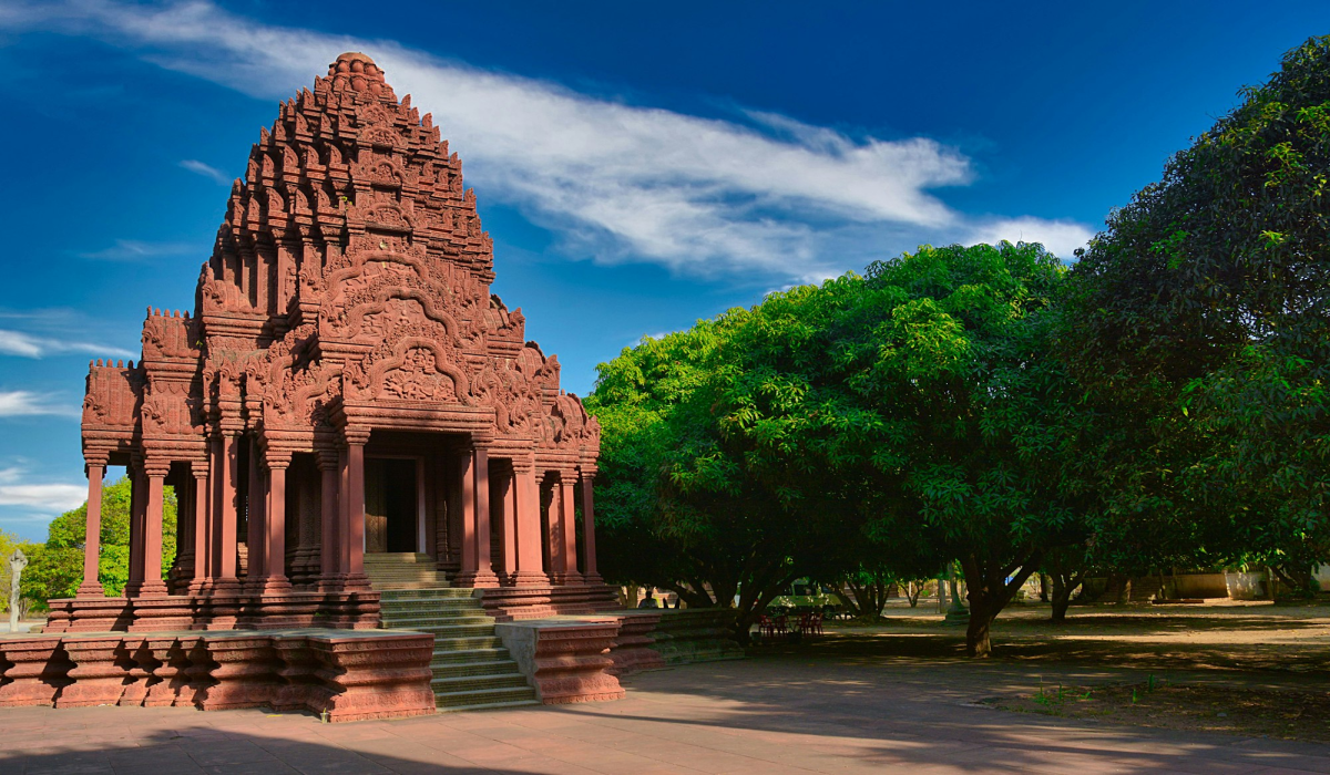 Ancient Southeast Asian Temple Amidst Verdant Greenery and Azure Skies