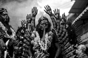 Devotion and Sacrifice Embodied: A Mythological Figure Adorned in Garland