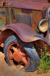 Forgotten Relic: An Abandoned Vintage Car in Rust