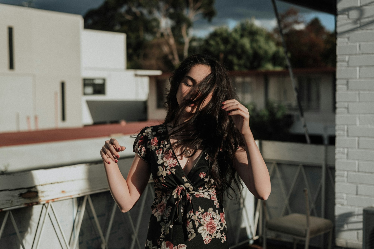 Girl Embracing Nature in Floral Top