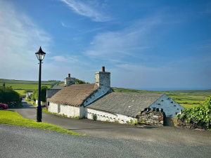 Scenic Serenity of Cregneash's Thatched Cottage, Isle of Man, United Kingdom