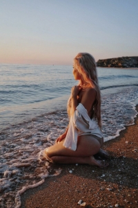 Sunset Beach Escapade: Captivating Model Girl at the Seashore