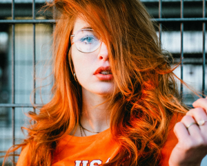 Vibrant Vision: The Charm of Orange Hair and Clear Frames